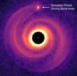 Astronomers discover elusive planet responsible for spiral arms around its star 2