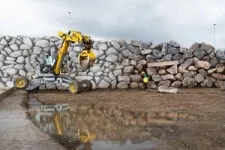 Autonomous excavator constructs a 6-meter-high dry-stone wall 2