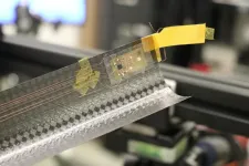 Flexible electronics integrated with paper-thin structure for use in space