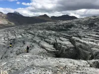 Glaciologists measure, model hard glacier beds, write slip law to estimate glacier speeds