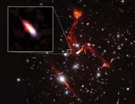 Image release: Cosmic lens reveals faint radio galaxy