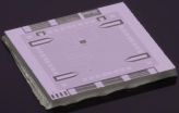 NIST prototype optics table on a chip places microwave photon in 2 colors at once