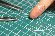 Shape-shifting ultrasound stickers detect post-surgical complications