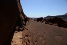 Stone age artists carved detailed human and animal tracks in rock art in Namibia 2